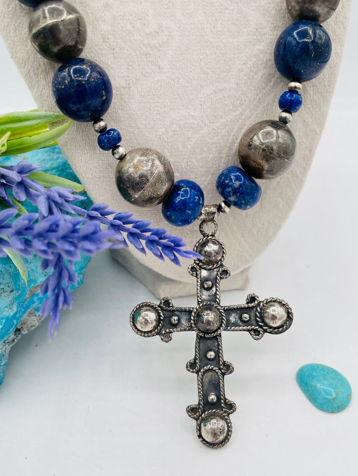 Chunky beaded necklace featuring lapis lazuli and sterling silver beads with a sterling silver cross. Available only from Rockstar Cowgirl online or in store in Cody, Wyoming.