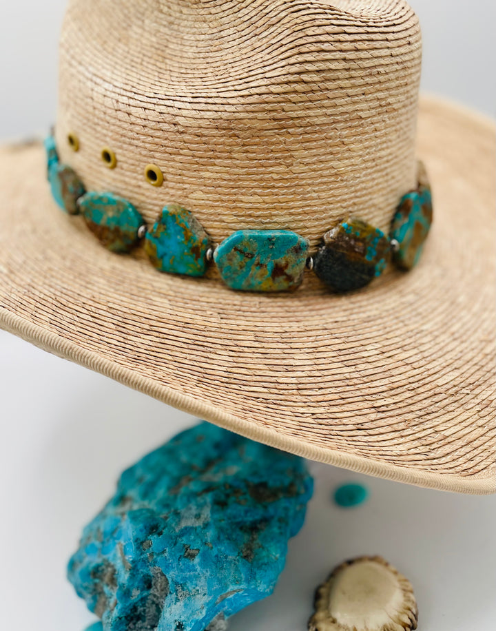 Adjustable beaded hatband that double as a necklace featuring Kingman turquoise flats and sterling silver beads finished with deer lace in the back. Available only from Rockstar Cowgirl online or in store in Cody, Wyoming.