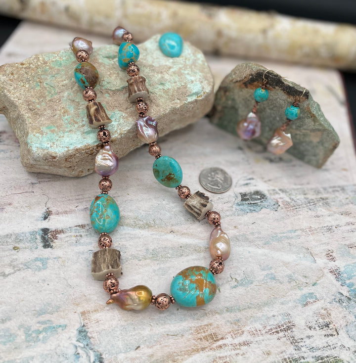 Kingman turquoise, natural luster baroque pearls, knobby deer antler beads, and copper lava beaded necklace with matching earrings. U.S. quarter for size reference. Available only from Rockstar Cowgirl online or in store in Cody, Wyoming..