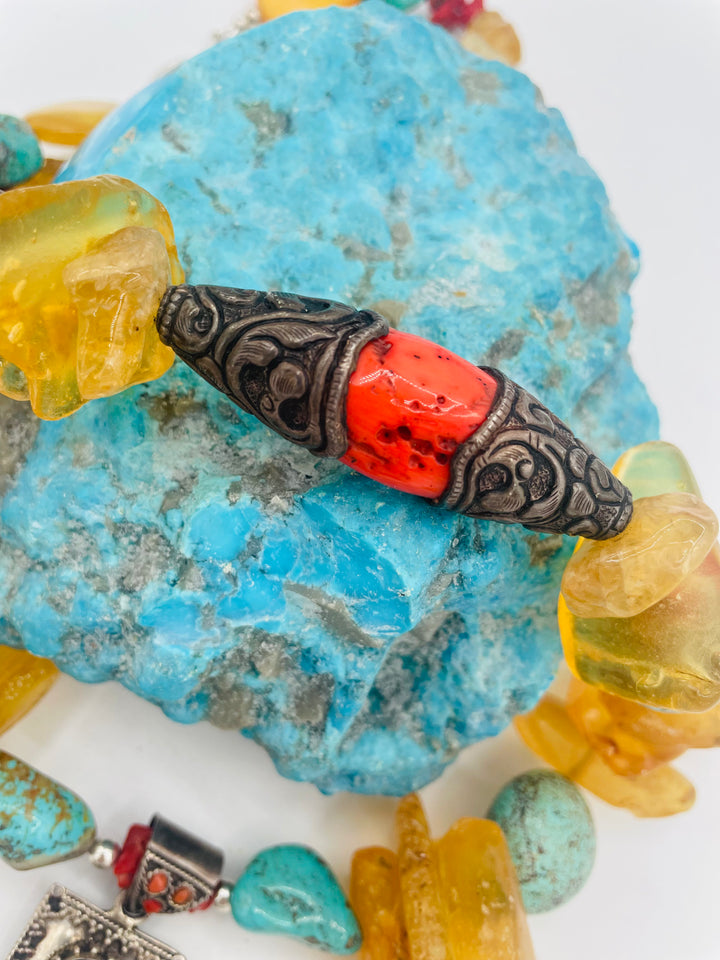 Beaded necklace featuring #8 turquoise, yellow Baltic amber, coral, sterling silver beads, silver and coral tube beads, and a sterling silver cross with #8 turquoise nuggets. Available only from Rockstar Cowgirl online or in store in Cody, Wyoming.