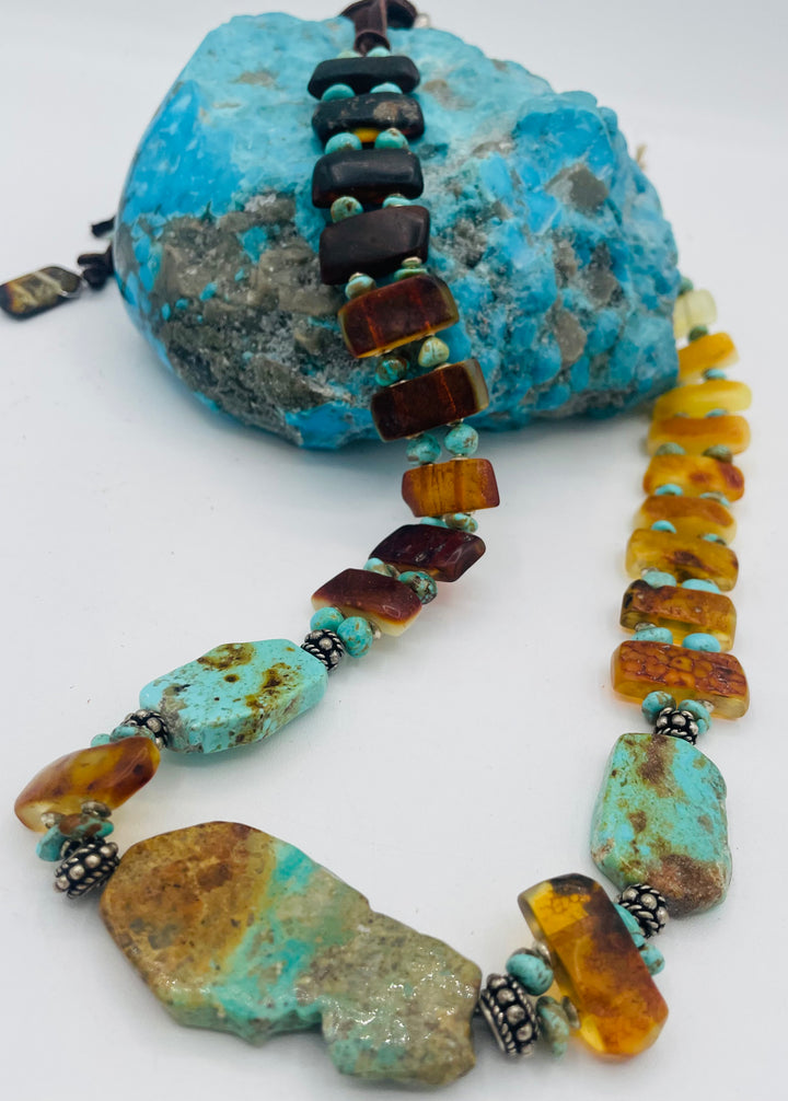 Adjustable beaded hatband featuring Kingman turquoise, Sonoran turquoise, Baltic amber with silver details, and finished with deer lace in the back. Available only from Rockstar Cowgirl online or in store in Cody, Wyoming.