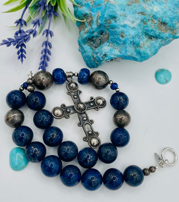 Chunky beaded necklace featuring lapis lazuli and sterling silver beads with a sterling silver cross. Available only from Rockstar Cowgirl online or in store in Cody, Wyoming.
