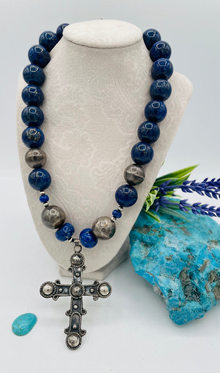 Chunky beaded necklace featuring lapis lazuli and sterling silver beads with a sterling silver cross. Available only from Rockstar Cowgirl online or in store in Cody, Wyoming.