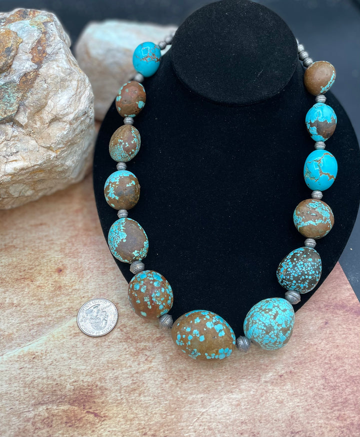Giant graduated #8 turquoise necklace with etched sterling silver beads. U.S. quarter for size reference. Available only from Rockstar Cowgirl online or in store in Cody, Wyoming.