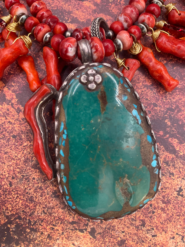 Close up on the turquoise and coral pendent, red spiny oyster, coral spikes, and sterling silver beads in this 2 strand necklace. Available only from Rockstar Cowgirl online or in store in Cody, Wyoming.
