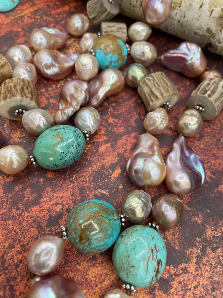 Close up of the matrix in the Kingman turquoise, the colors in the baroque and Edison pearls, and the textures on the deer antler beads. Available only from Rockstar Cowgirl online or in store in Cody, Wyoming.