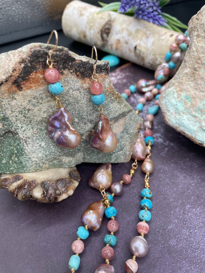 Close up of the earrings featuring Natural luster baroque pearls, rhodochrosite, and turquoise. Available only from Rockstar Cowgirl online or in store in Cody, Wyoming.