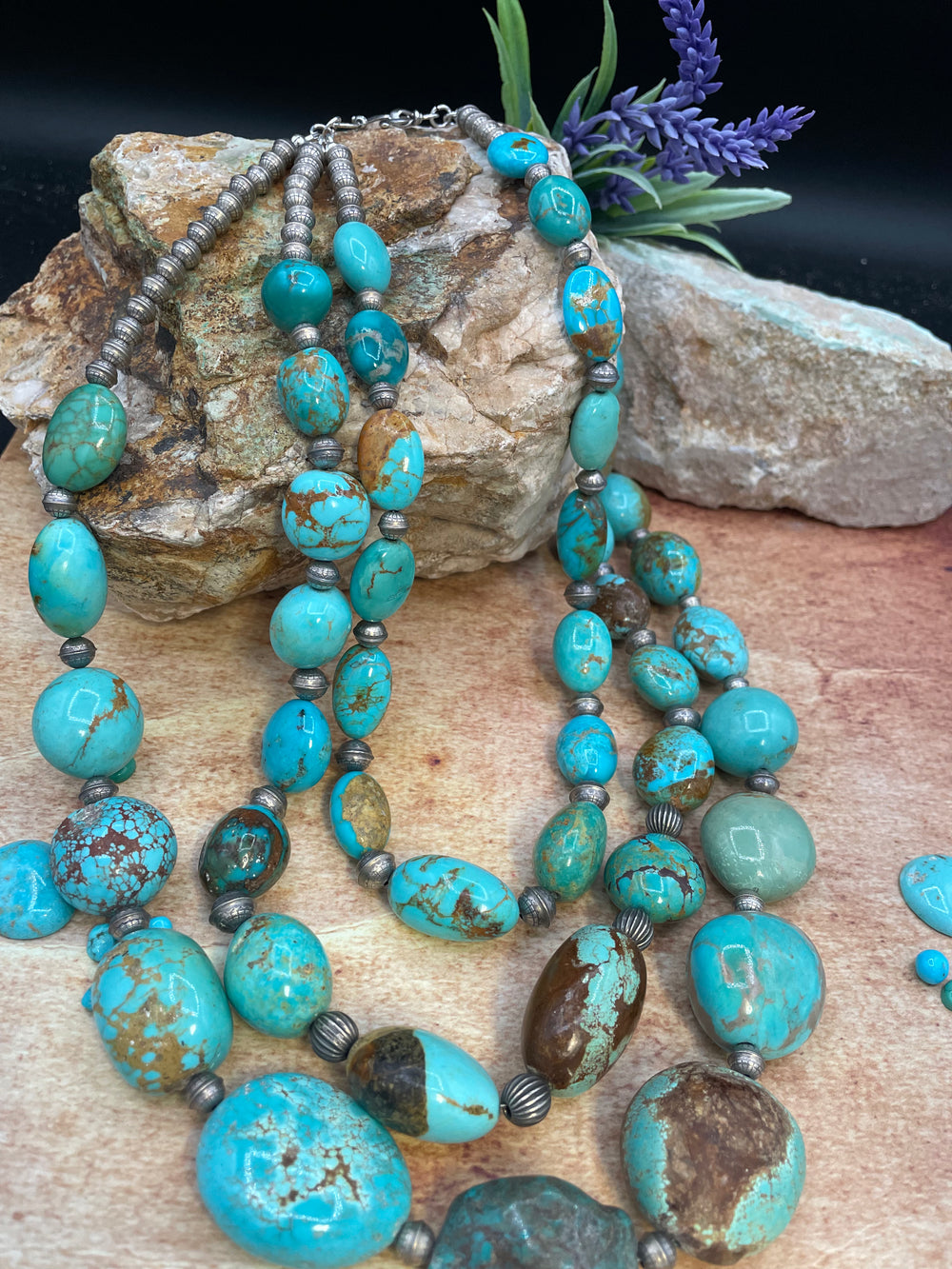 Close up of the matrix in the large #8 turquoise nuggets with sterling silver etched beads in this 3 strand necklace. Available only from Rockstar Cowgirl online or in store in Cody, Wyoming.