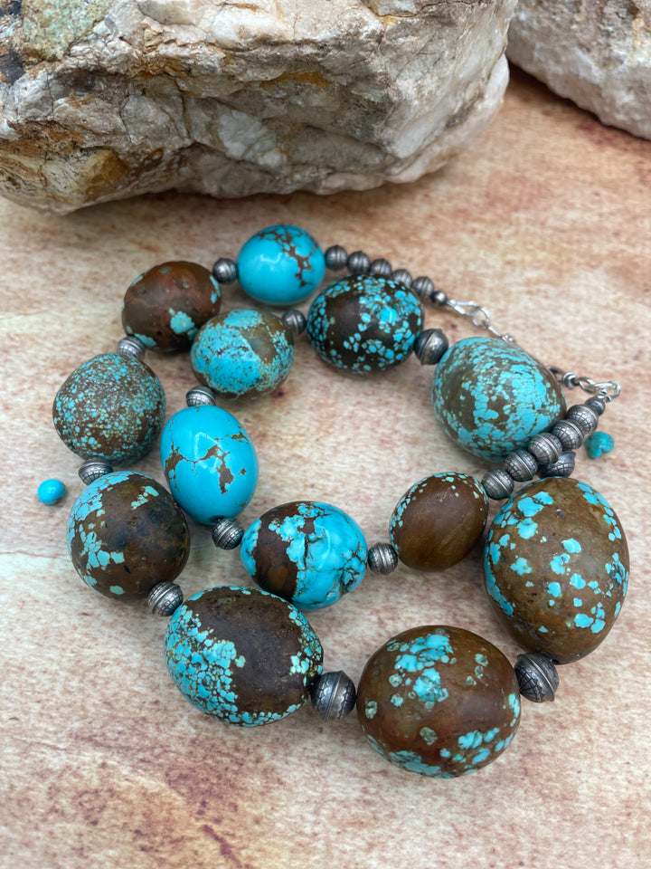Close up of the matrix of the #8 turquoise and the texture of the etched sterling silver beads in this graduated necklace. Available only from Rockstar Cowgirl online or in store in Cody, Wyoming.