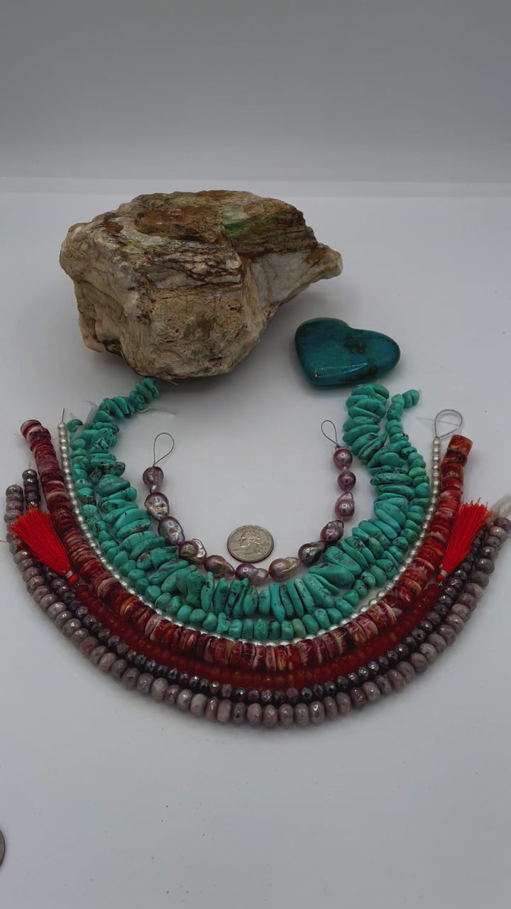 Bead box featuring natural luster baroque flame ball pearls, Campitios turquoise, small pearls, carnelian, spiney oyster, and silverite. U.S. quarter for size reference. Available only from Rockstar Cowgirl online or in store in Cody, Wyoming.