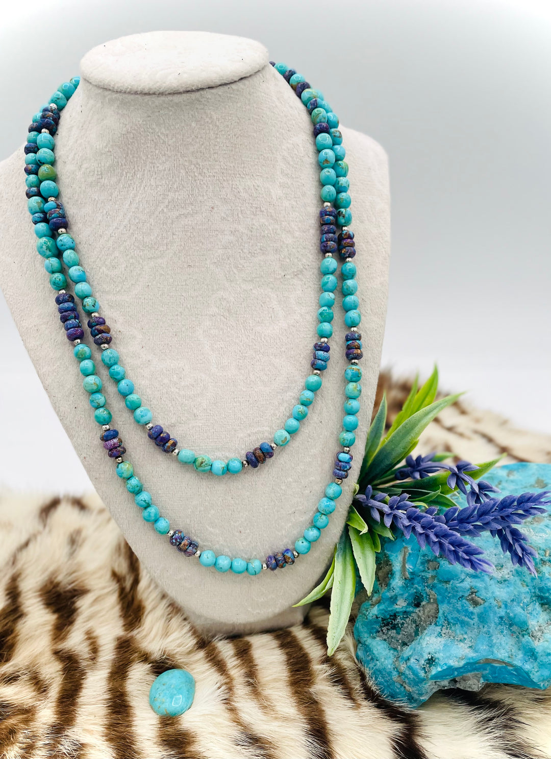 Beaded invention necklace featuring Kingman turquoise, purple Mojave turquoise, sterling silver beads, sterling silver swivel lobsters, eye glasses loops, cell phone case attachment bracket. Available only from Rockstar Cowgirl online or in store in Cody, Wyoming.