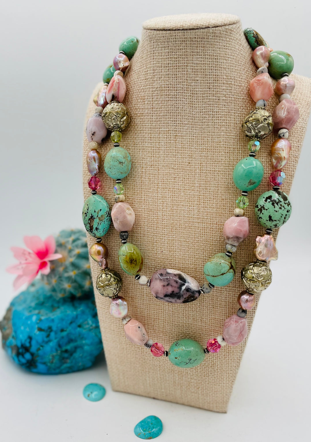 Adjustable beaded necklace featuring Kingman turquoise nuggets, pink opal, pearls, Swarovski crystals, dendrite opal, sterling silver beads, repousse beads, and finished with deer lace and slide bead. Available only from Rockstar Cowgirl online or in store in Cody, Wyoming.