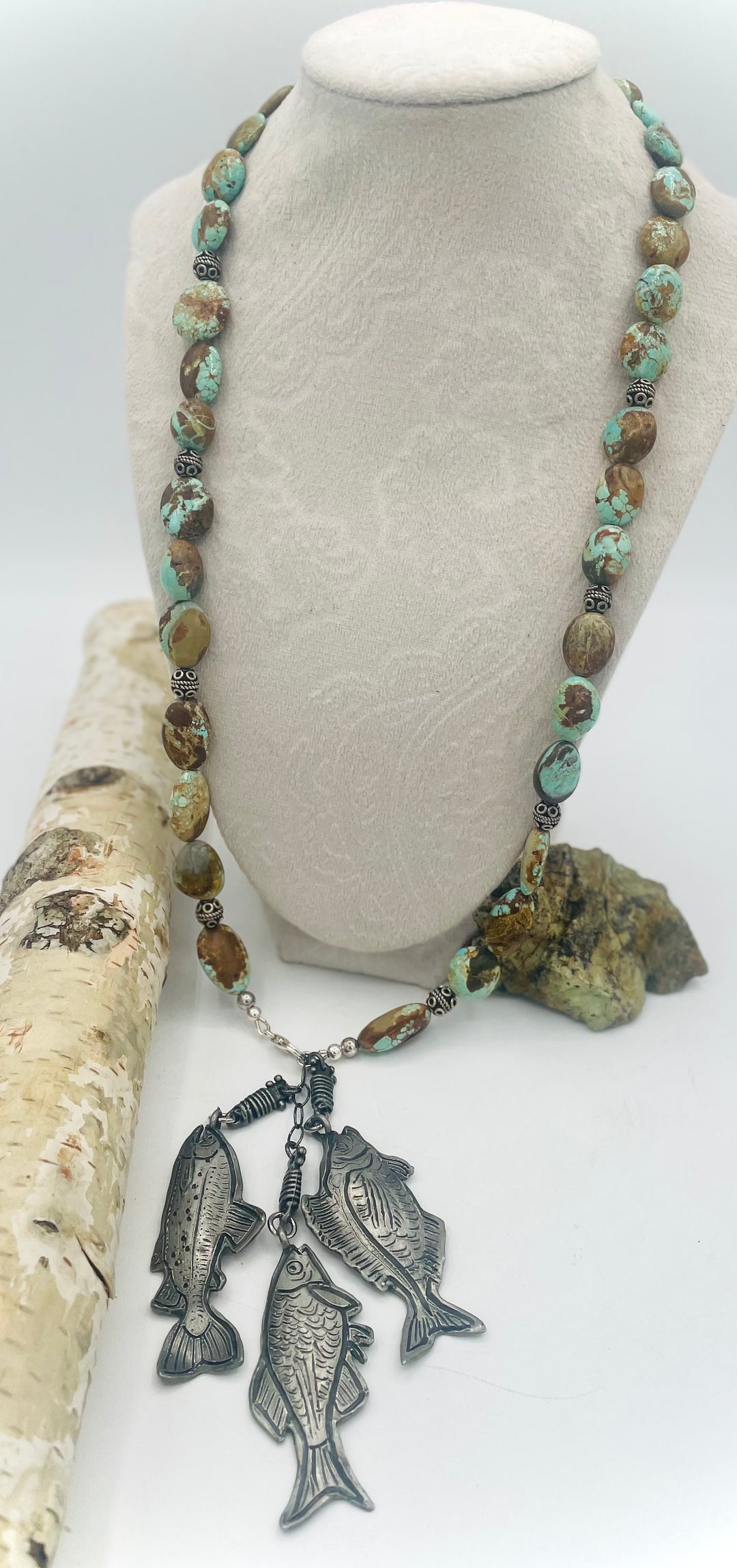 Beaded necklace featuring vintage #8 turquoise nuggets, sterling silver beads, and handmade sterling silver signed fish charms. Marcie. Available only from Rockstar Cowgirl online or in store in Cody, Wyoming.