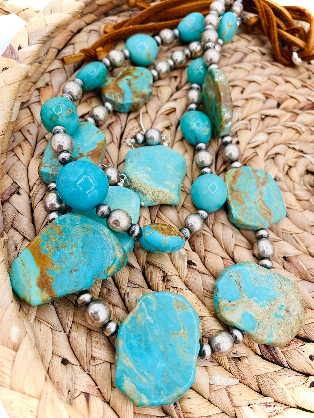 Beaded two strand necklace featuring Kingman turquoise and sterling silver beads and finished with  deer lace and slide bead. Including matching earrings. Available only from Rockstar Cowgirl online or in store in Cody, Wyoming.