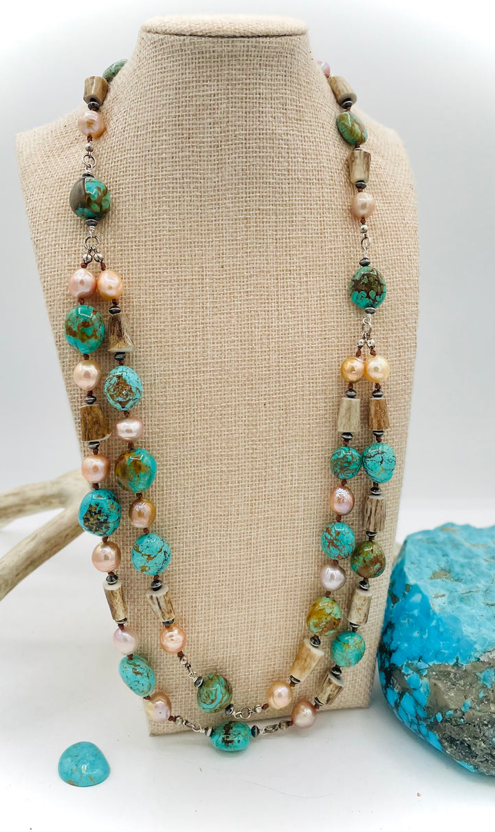 Silk knotted and wire wrapped treasure necklace with two nested strands featuring Kingman turquoise nuggets, deer antler beads, Edison natural luster pearls, and sterling silver beads. Available only from Rockstar Cowgirl online or in store in Cody, Wyoming.