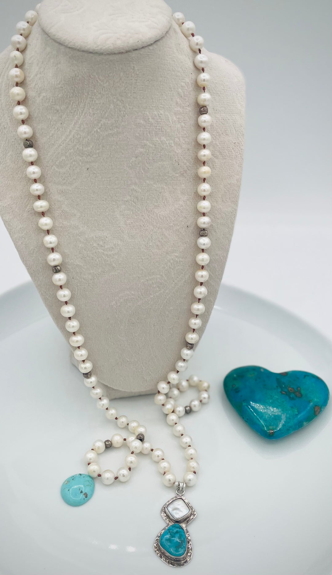 Silk knotted long necklace featuring white pearls, and sterling silver beads with a pearl and turquoise sterling silver pendent. Available only from Rockstar Cowgirl online or in store in Cody, Wyoming.