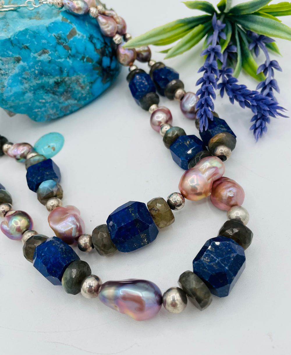 Beaded double stranded necklace featuring lapis, natural luster baroque pearls, labradorite, and sterling silver beads. Matching earrings included. Available only from Rockstar Cowgirl online or in store in Cody, Wyoming.