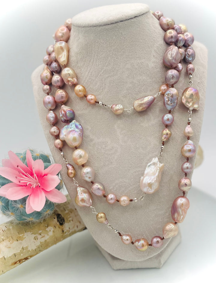 Silk knotted and wire wrapped long treasure necklace featuring natural luster, baroque, Flameball, and Edison pearls with sterling silver accents. Available only from Rockstar Cowgirl online or in store in Cody, Wyoming.