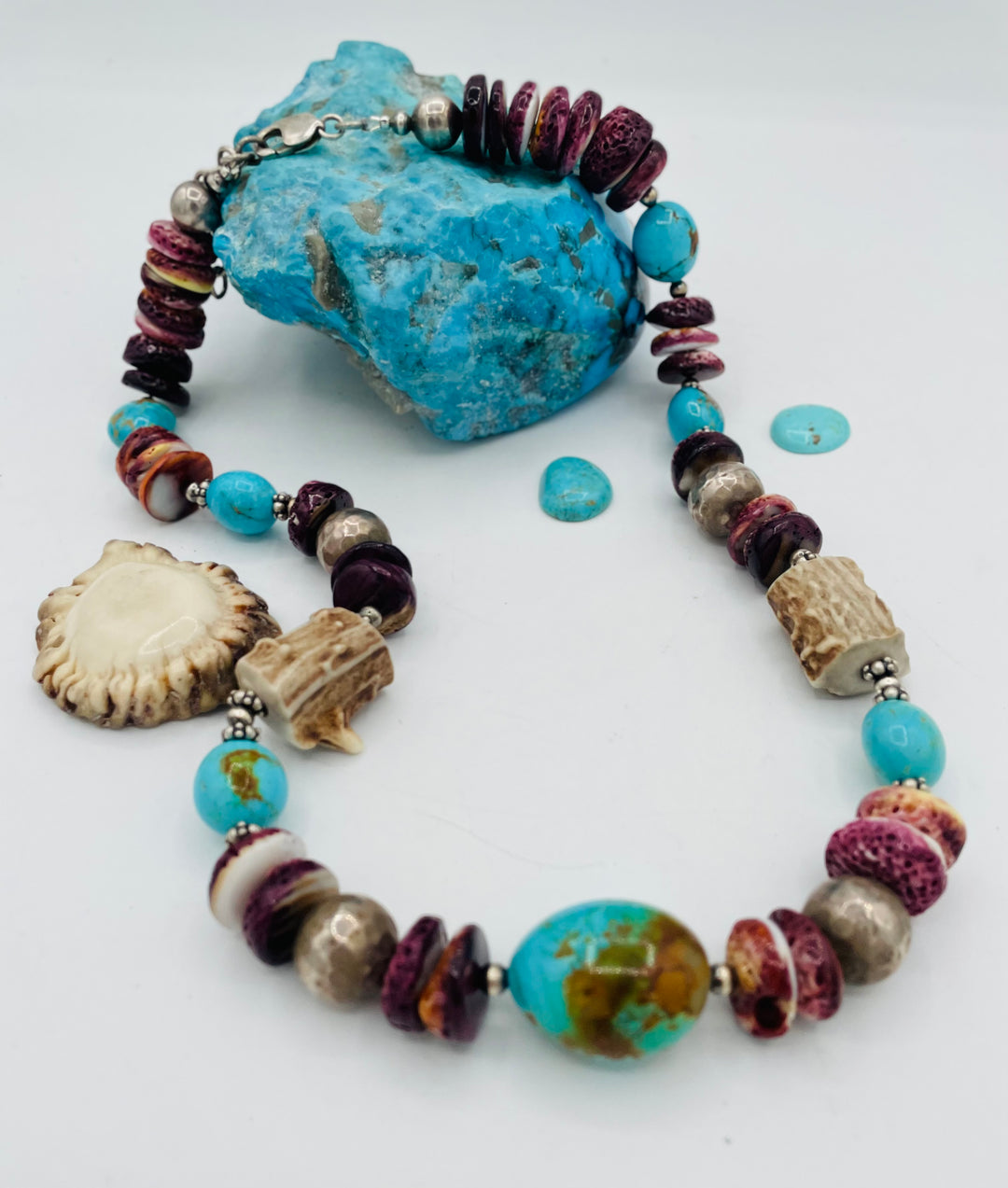 Beaded necklace featuring Antler beads, purple spiney oyster, Kingman turquoise nuggets, and sterling silver beads. Available only from Rockstar Cowgirl online or in store in Cody, Wyoming.