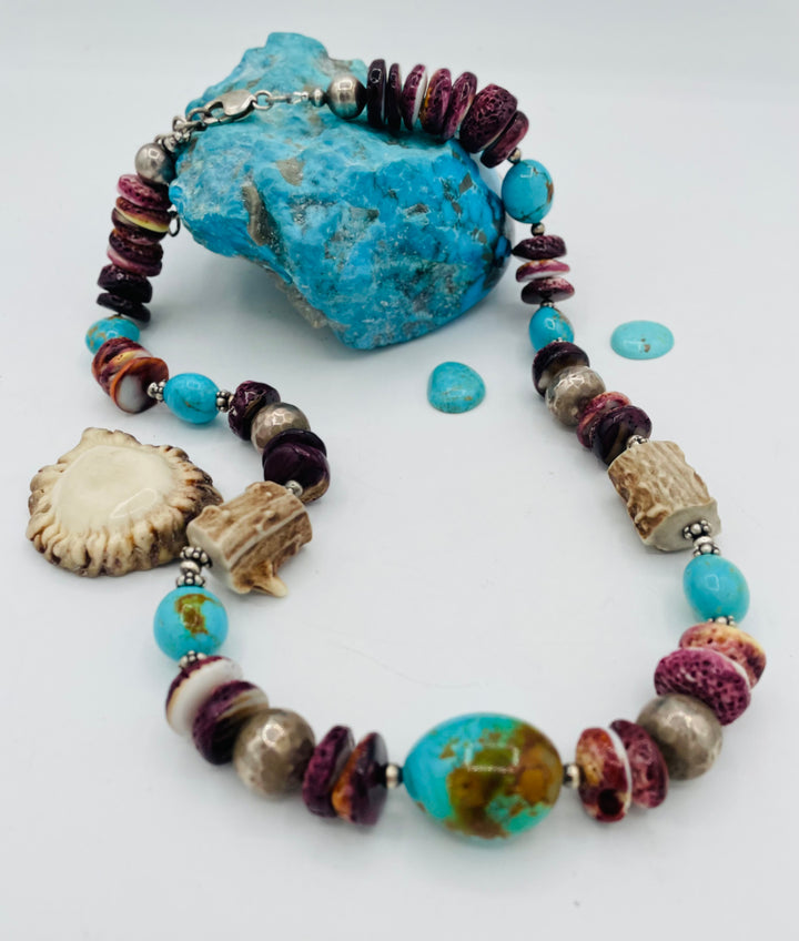 Beaded necklace featuring Antler beads, purple spiney oyster, Kingman turquoise nuggets, and sterling silver beads. Available only from Rockstar Cowgirl online or in store in Cody, Wyoming.