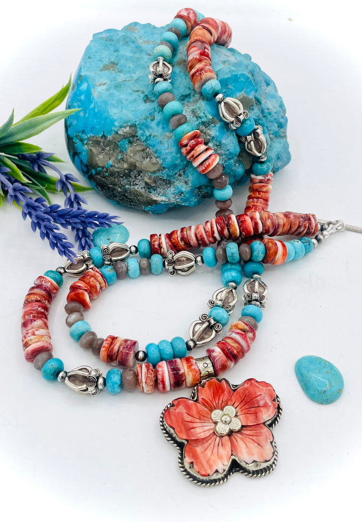Beaded 2 strand necklace featuring spiny oyster, royal beauty turquoise, brown moonstone, and sterling silver beads with a spiny oyster flower pendent. Available only from Rockstar Cowgirl online or in store in Cody, Wyoming.