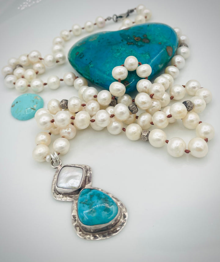 Silk knotted long necklace featuring white pearls, and sterling silver beads with a pearl and turquoise sterling silver pendent. Available only from Rockstar Cowgirl online or in store in Cody, Wyoming.