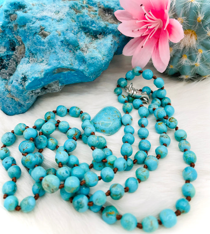 Silk knotted Kingman turquoise necklace, phone holder strap, or eyeglass holder featuring sterling silver swivel lobsters for various attachments or uses. Comes with phone case attachments and eye glasses loops. Available only from Rockstar Cowgirl online or in store in Cody, Wyoming.