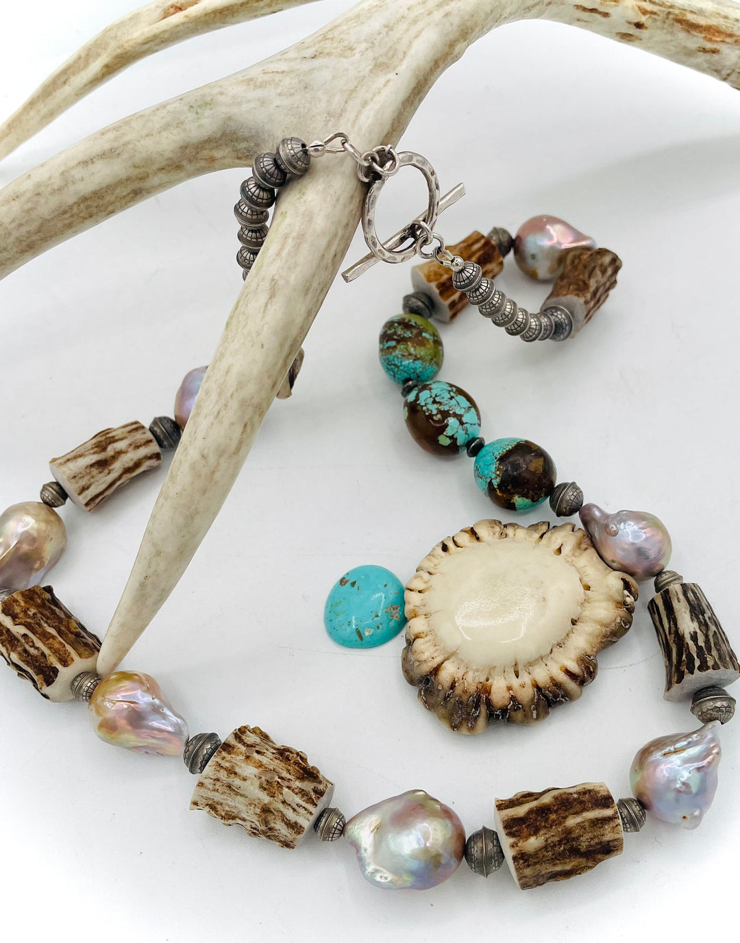Handmade beaded necklace featuring textured deer antler beads, #8 turquoise nuggets, natural luster flameball pearls, and sterling silver beads. Available only from Rockstar Cowgirl online or in store in Cody, Wyoming. 