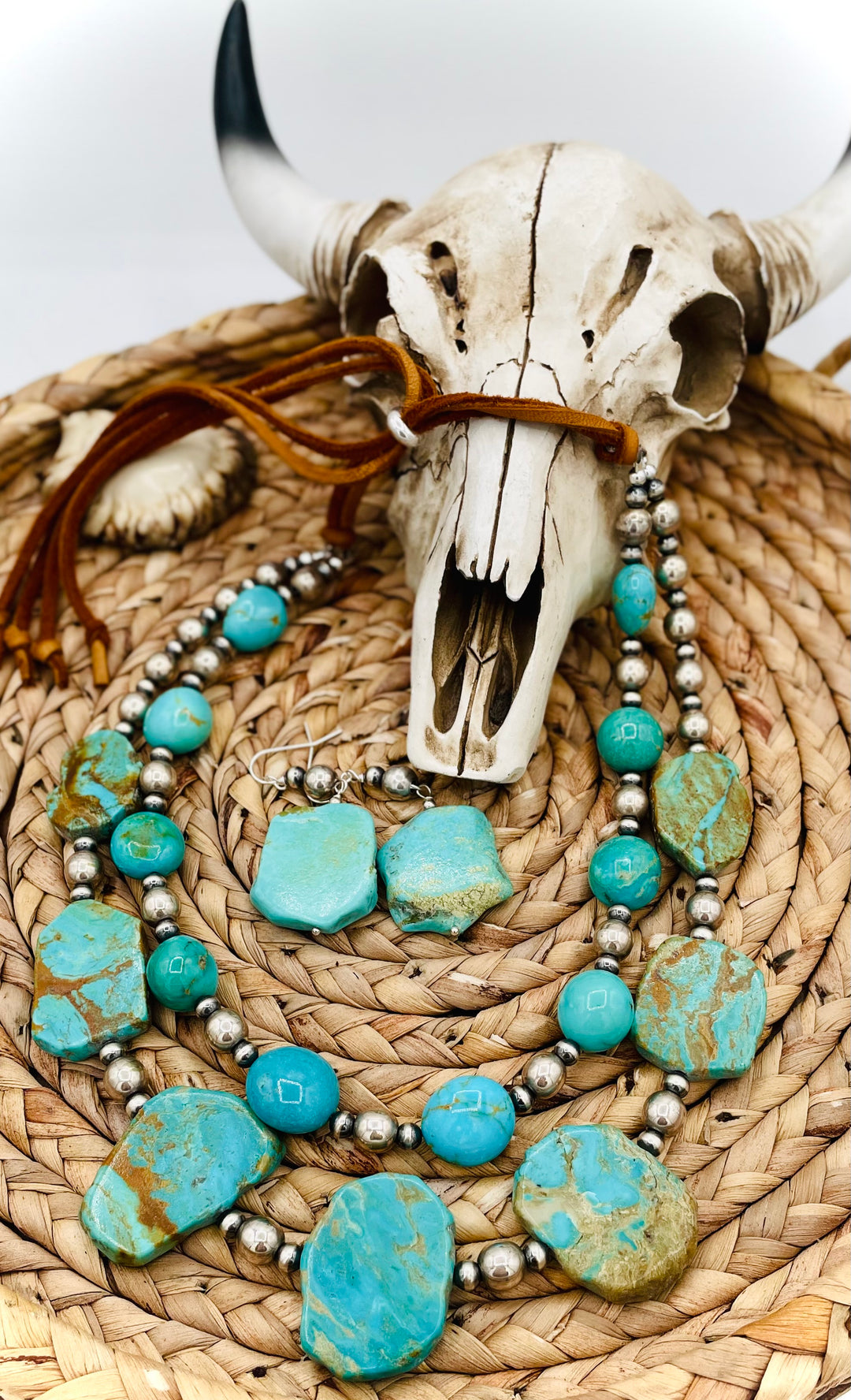 Beaded two strand necklace featuring Kingman turquoise and sterling silver beads and finished with  deer lace and slide bead. Including matching earrings. Available only from Rockstar Cowgirl online or in store in Cody, Wyoming.