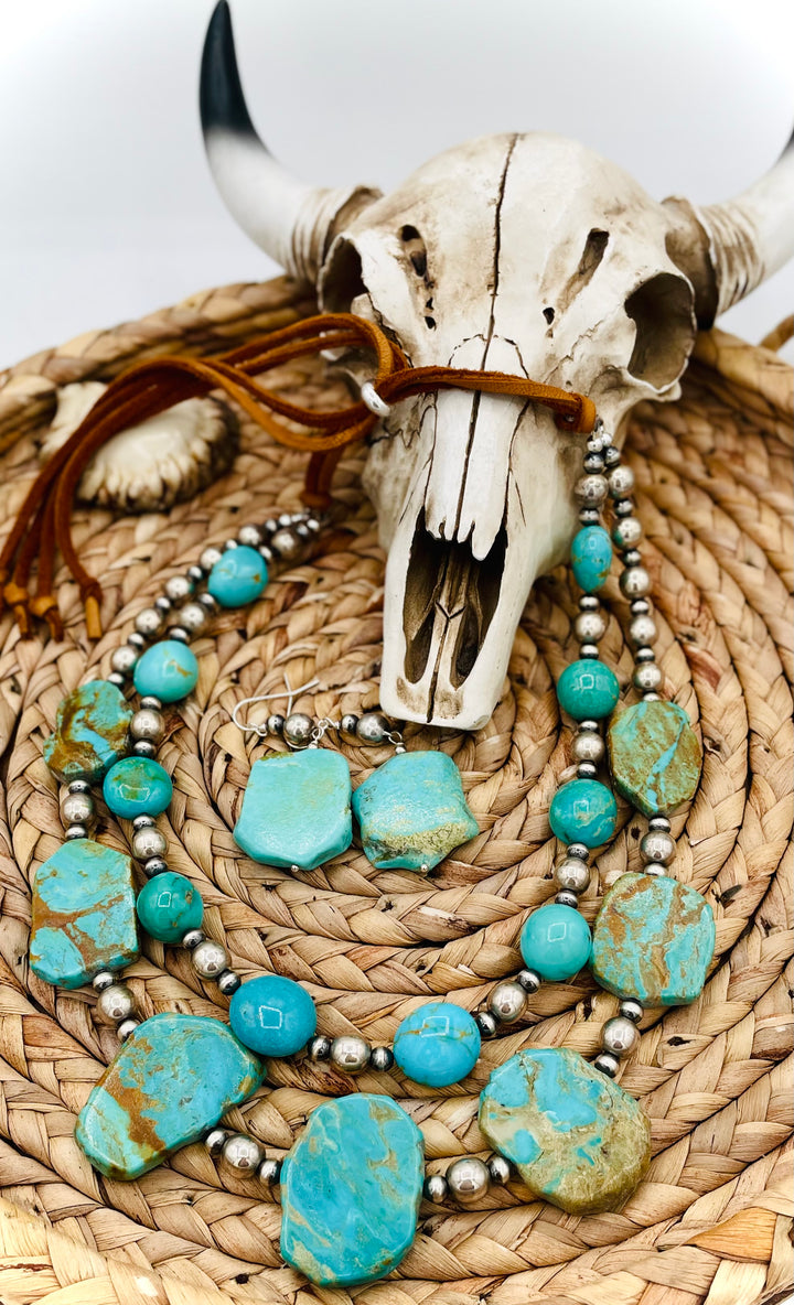Beaded two strand necklace featuring Kingman turquoise and sterling silver beads and finished with  deer lace and slide bead. Including matching earrings. Available only from Rockstar Cowgirl online or in store in Cody, Wyoming.