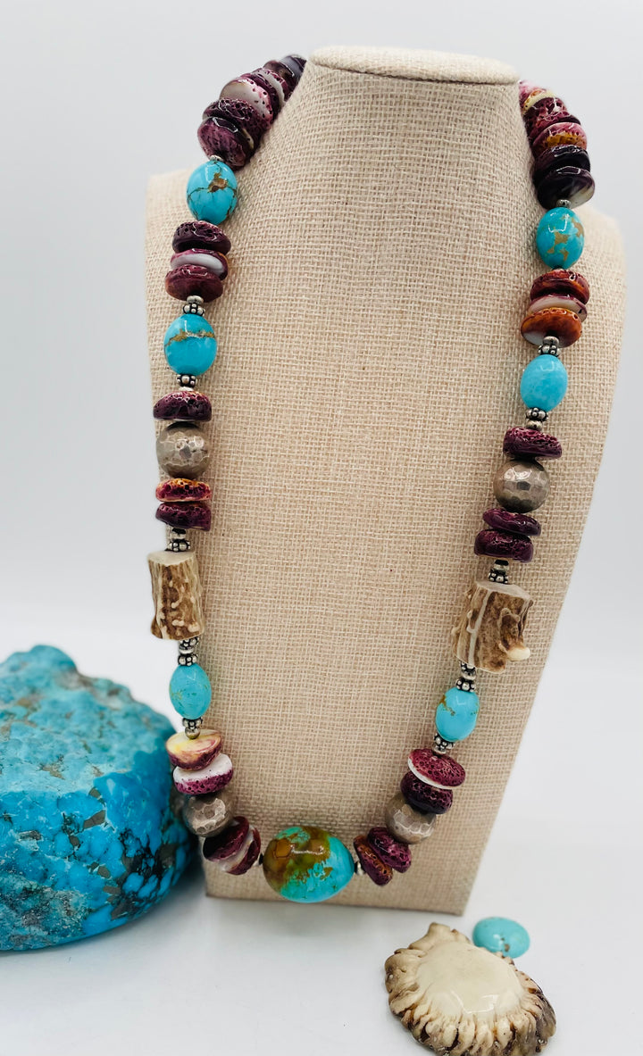 Beaded necklace featuring Antler beads, purple spiney oyster, Kingman turquoise nuggets, and sterling silver beads. Available only from Rockstar Cowgirl online or in store in Cody, Wyoming.