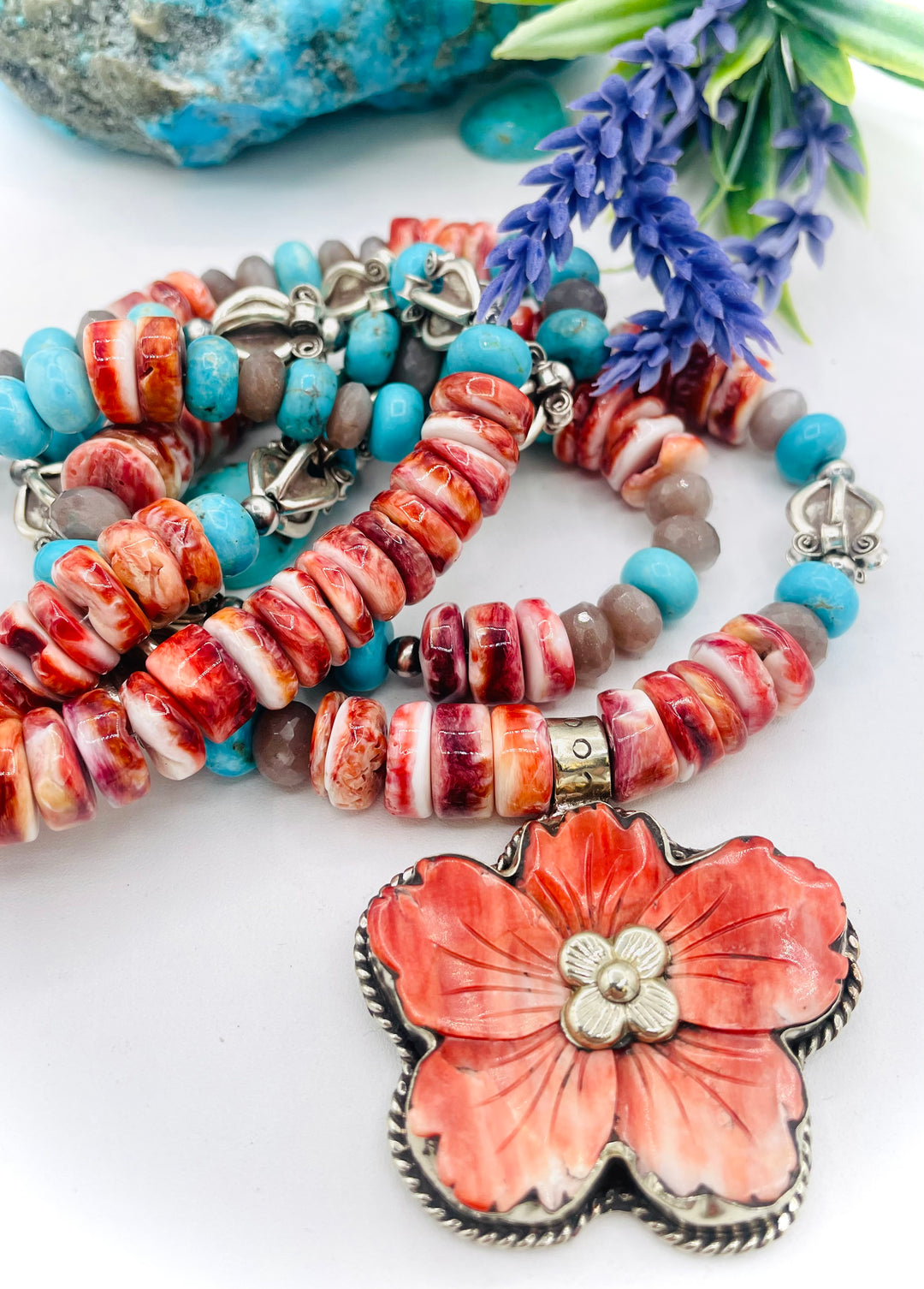 Beaded 2 strand necklace featuring spiny oyster, royal beauty turquoise, brown moonstone, and sterling silver beads with a spiny oyster flower pendent. Available only from Rockstar Cowgirl online or in store in Cody, Wyoming.