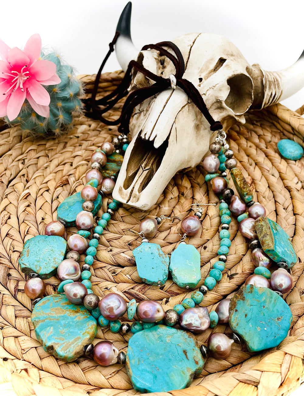 Beaded three strand necklace featuring Kingman turquoise, natural luster pearls, sterling silver beads, and finished with deer lace and slide bead. Includes matching earrings. Available only from Rockstar Cowgirl online or in store in Cody, Wyoming.