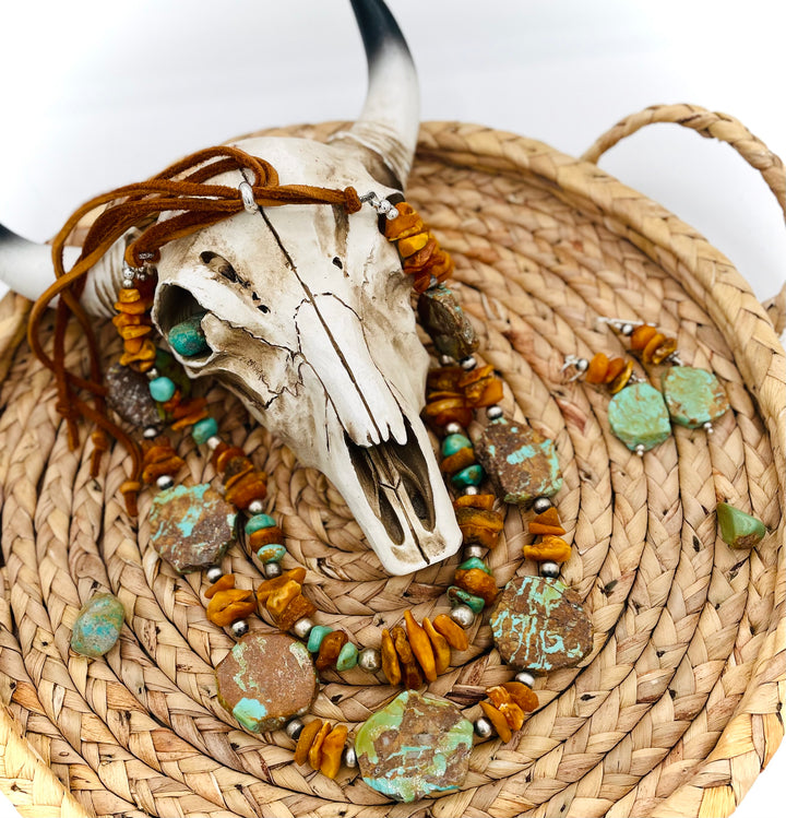 Beaded three strand necklace featuring Kingman turquoise, butterscotch amber, sterling silver beads, deer lace, and slide bead. Includes matching earrings. Available only from Rockstar Cowgirl online or in store in Cody, Wyoming.