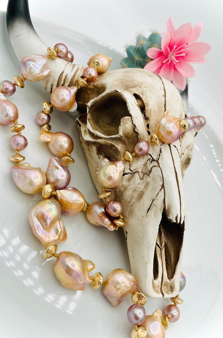 Silk knotted 2 strand necklace featuring flame ball natural luster pearls, smaller pink pearls, 14k gold accents, and finished a small turquoise heart at the back. Available only from Rockstar Cowgirl online or in store in Cody, Wyoming.
