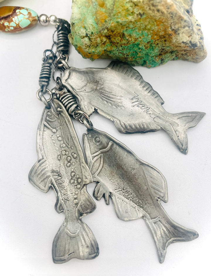 Beaded necklace featuring vintage #8 turquoise nuggets, sterling silver beads, and handmade sterling silver signed fish charms. Marcie. Available only from Rockstar Cowgirl online or in store in Cody, Wyoming.