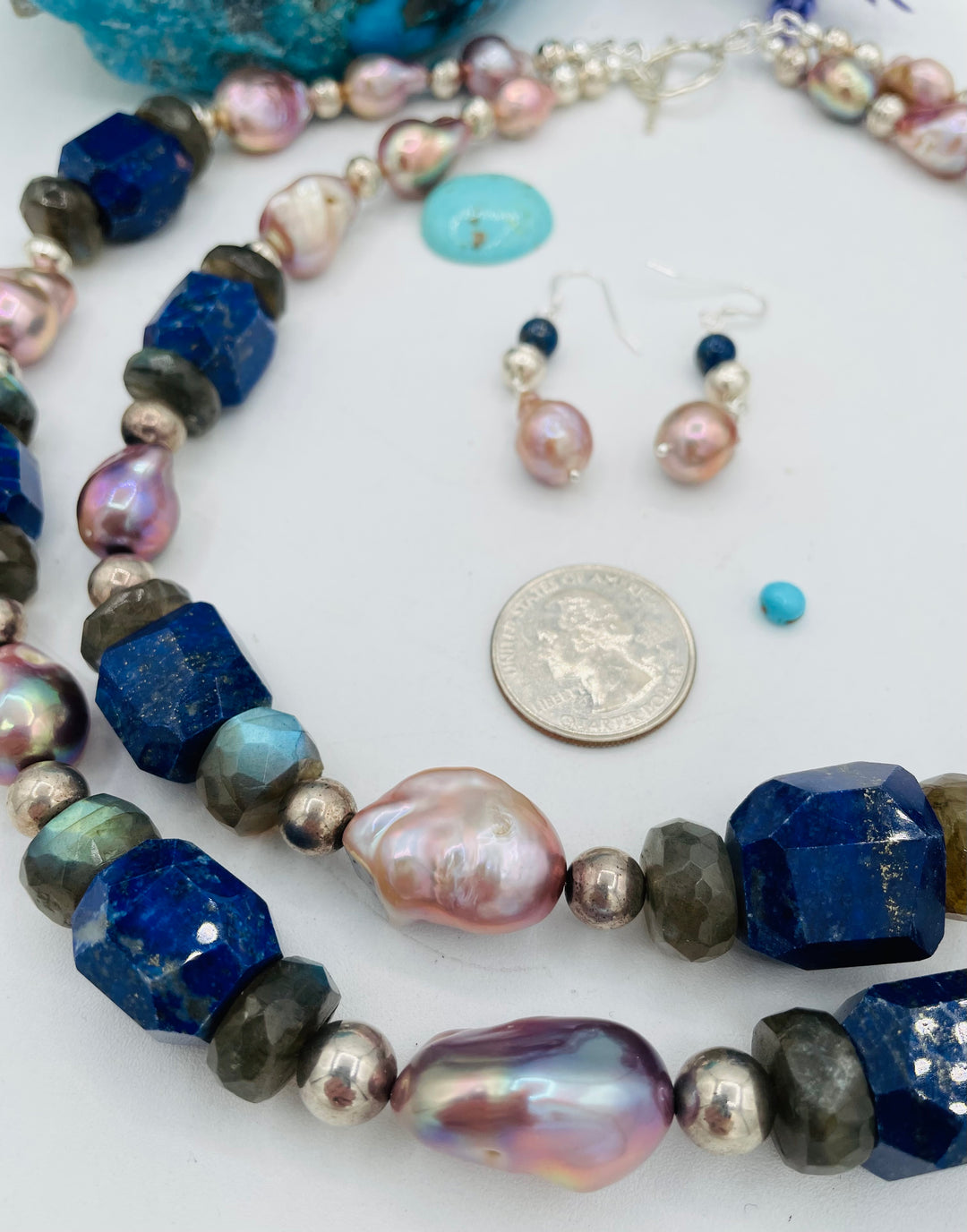 Beaded double stranded necklace featuring lapis, natural luster baroque pearls, labradorite, and sterling silver beads. Matching earrings included. U.S. quarter for size reference. Available only from Rockstar Cowgirl online or in store in Cody, Wyoming.