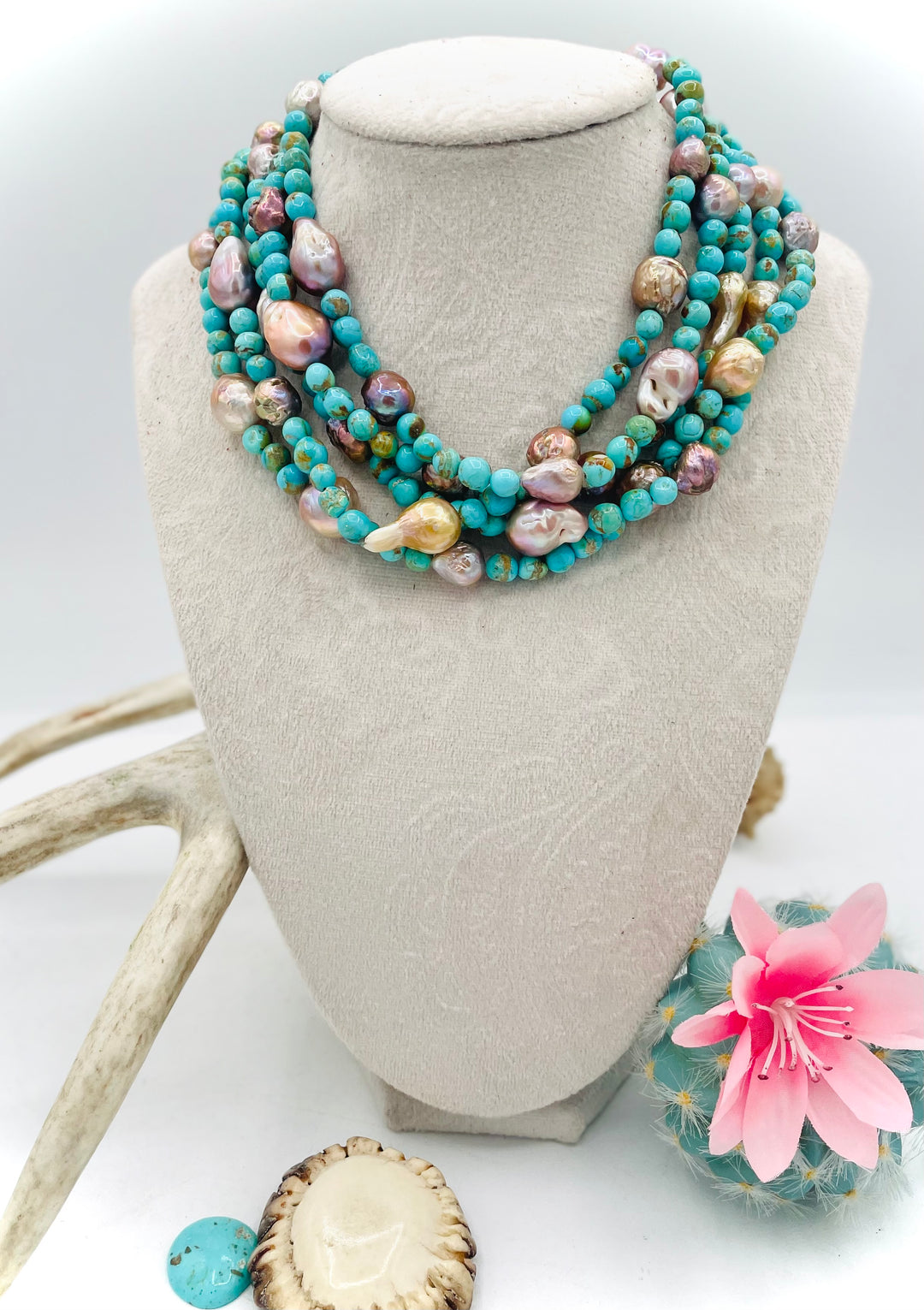 Handmade extra long beaded necklace featuring Kingman turquoise and natural luster baroque pearls. Available only from Rockstar Cowgirl online or in store in Cody, Wyoming. 