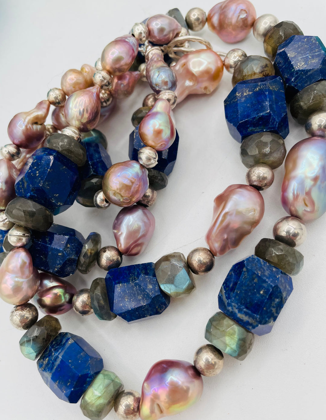 Beaded double stranded necklace featuring lapis, natural luster baroque pearls, labradorite, and sterling silver beads. Matching earrings included. Available only from Rockstar Cowgirl online or in store in Cody, Wyoming.
