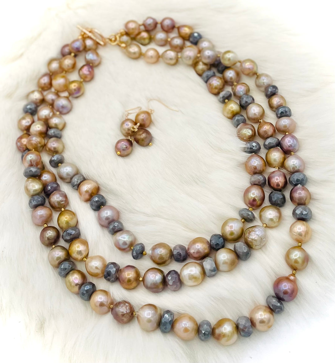 Beaded 2 strand necklace featuring natural luster pearls, grey silverite, and bronze accents with matching earrings. Available only from Rockstar Cowgirl online or in store in Cody, Wyoming.