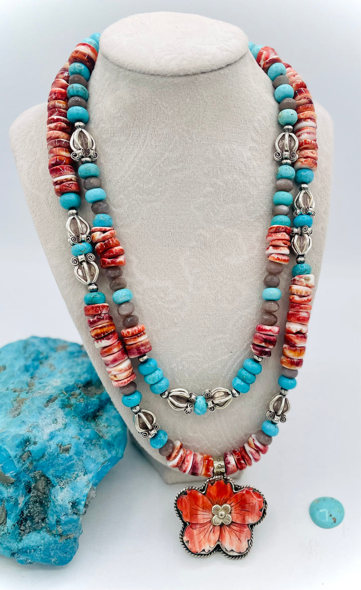 Beaded 2 strand necklace featuring spiny oyster, royal beauty turquoise, brown moonstone, and sterling silver beads with a spiny oyster flower pendent. Available only from Rockstar Cowgirl online or in store in Cody, Wyoming.