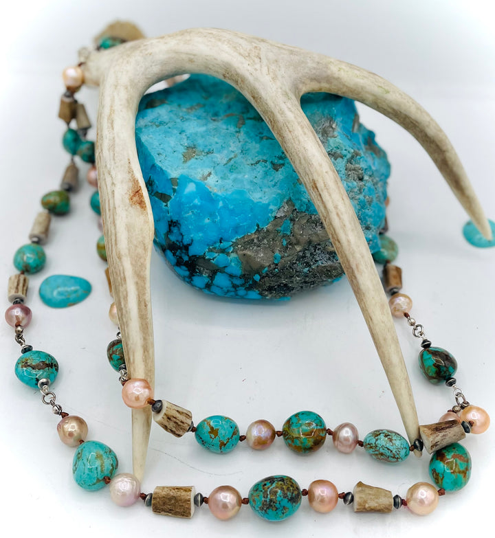 Silk knotted and wire wrapped treasure necklace with two nested strands featuring Kingman turquoise nuggets, deer antler beads, Edison natural luster pearls, and sterling silver beads. Available only from Rockstar Cowgirl online or in store in Cody, Wyoming.