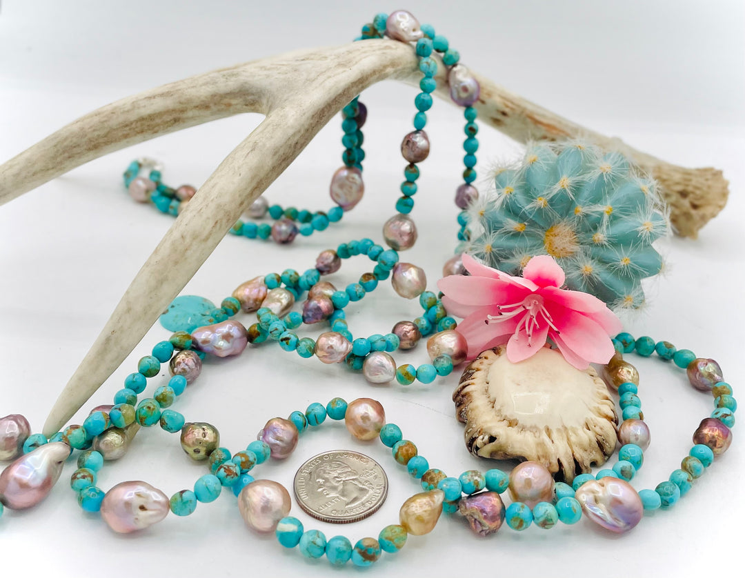Handmade extra long beaded necklace featuring Kingman turquoise and natural luster baroque pearls. U.S. quarter for size reference. Available only from Rockstar Cowgirl online or in store in Cody, Wyoming. 