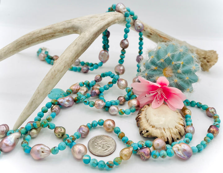 Handmade extra long beaded necklace featuring Kingman turquoise and natural luster baroque pearls. U.S. quarter for size reference. Available only from Rockstar Cowgirl online or in store in Cody, Wyoming. 