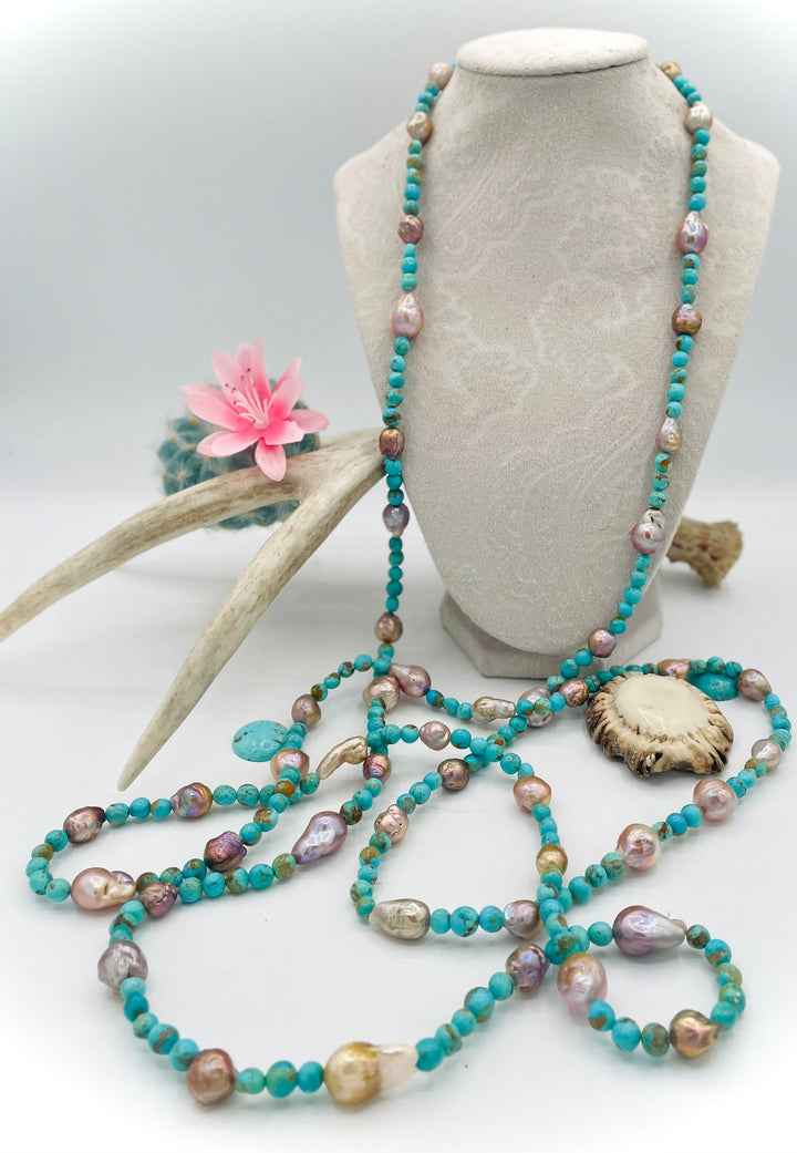 Handmade extra long beaded necklace featuring Kingman turquoise and natural luster baroque pearls. Available only from Rockstar Cowgirl online or in store in Cody, Wyoming. 