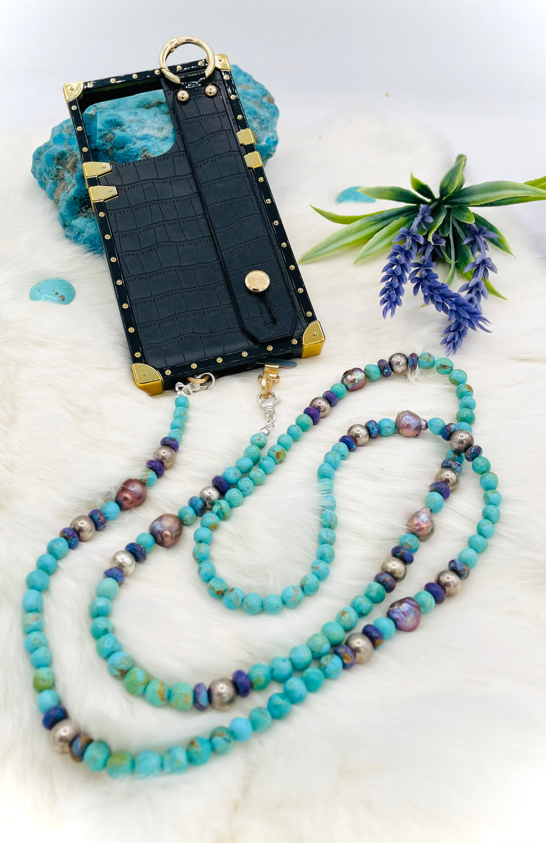 Beaded invention necklace featuring Kingman turquoise, Mojave Mohave turquoise, peacock pearls, sterling silver beads, and sterling silver swivel lobsters, with eye glasses loops and cell phone case attachment brackets. Available only from Rockstar Cowgirl online or in store in Cody, Wyoming.