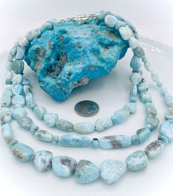 Beaded 3 strand necklace featuring Larimar nuggets and rondelles. U.S. quarter for size reference. Available only from Rockstar Cowgirl online or in store in Cody, Wyoming.