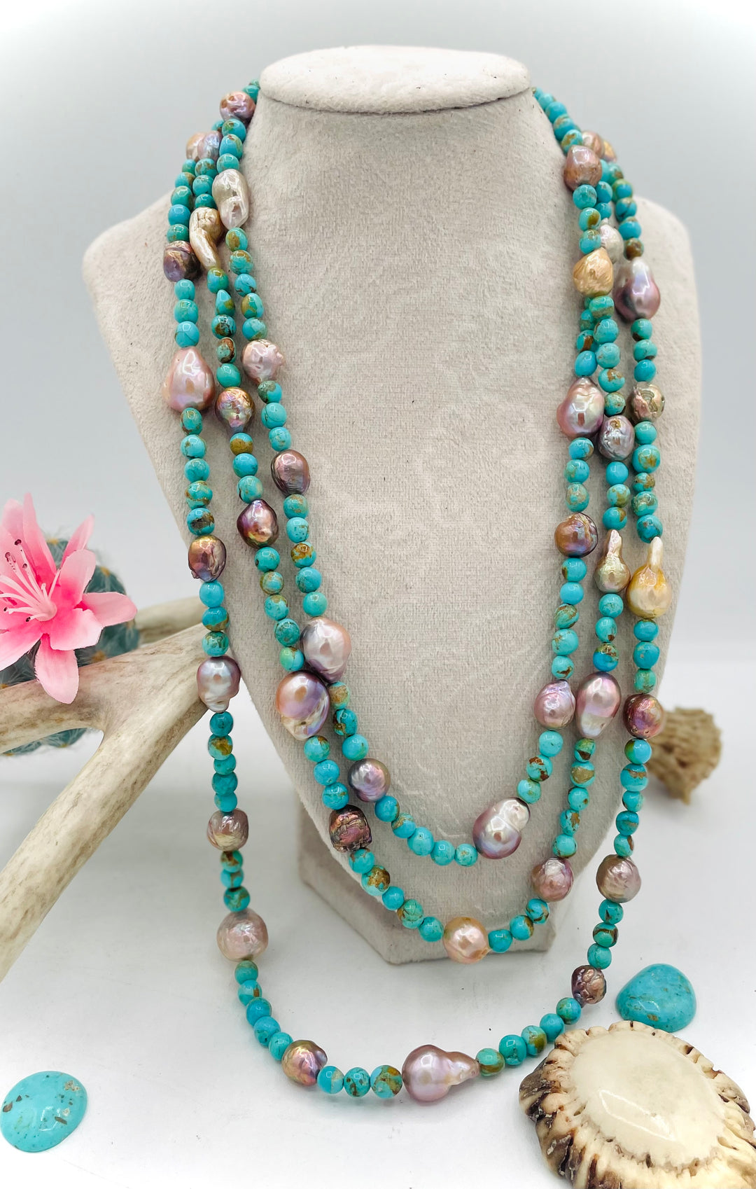 Handmade extra long beaded necklace featuring Kingman turquoise and natural luster baroque pearls. Available only from Rockstar Cowgirl online or in store in Cody, Wyoming. 