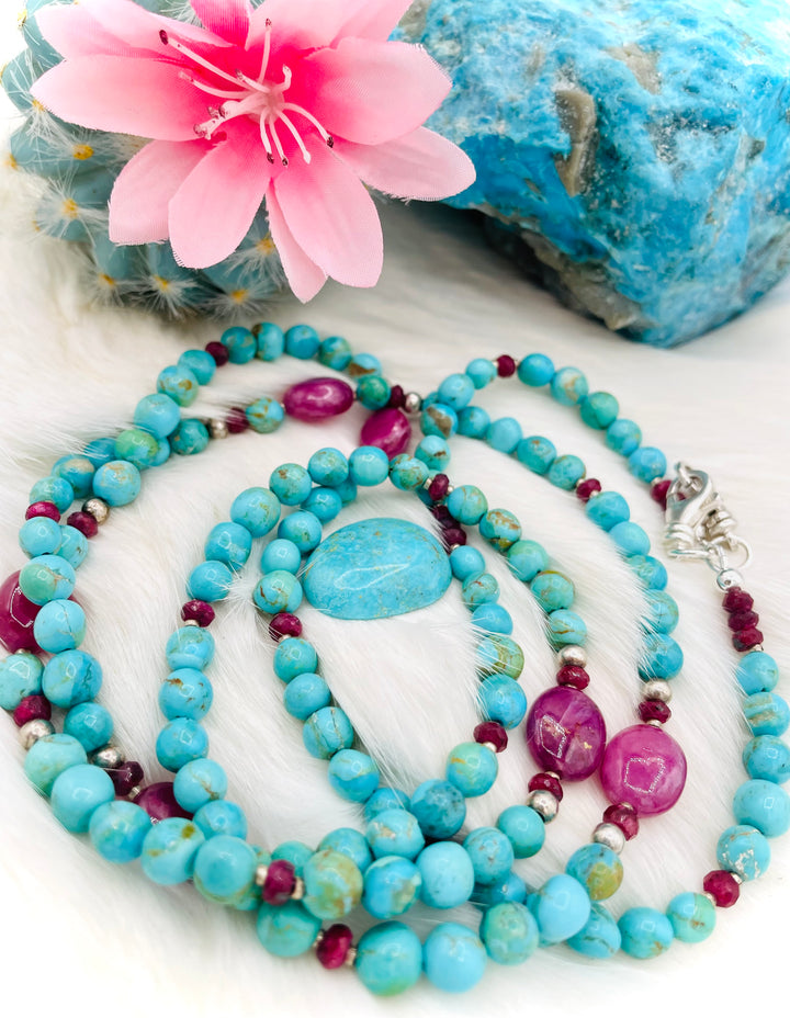 Beaded necklace, phone holder strap, or eye glass holder featuring blue Kingman turquoise, pink ruby nuggets and rondelles, sterling silver and African silver beads, sterling silver swivel lobsters, phone case attachments,  and glasses loops. Available only from Rockstar Cowgirl online or in store in Cody, Wyoming.