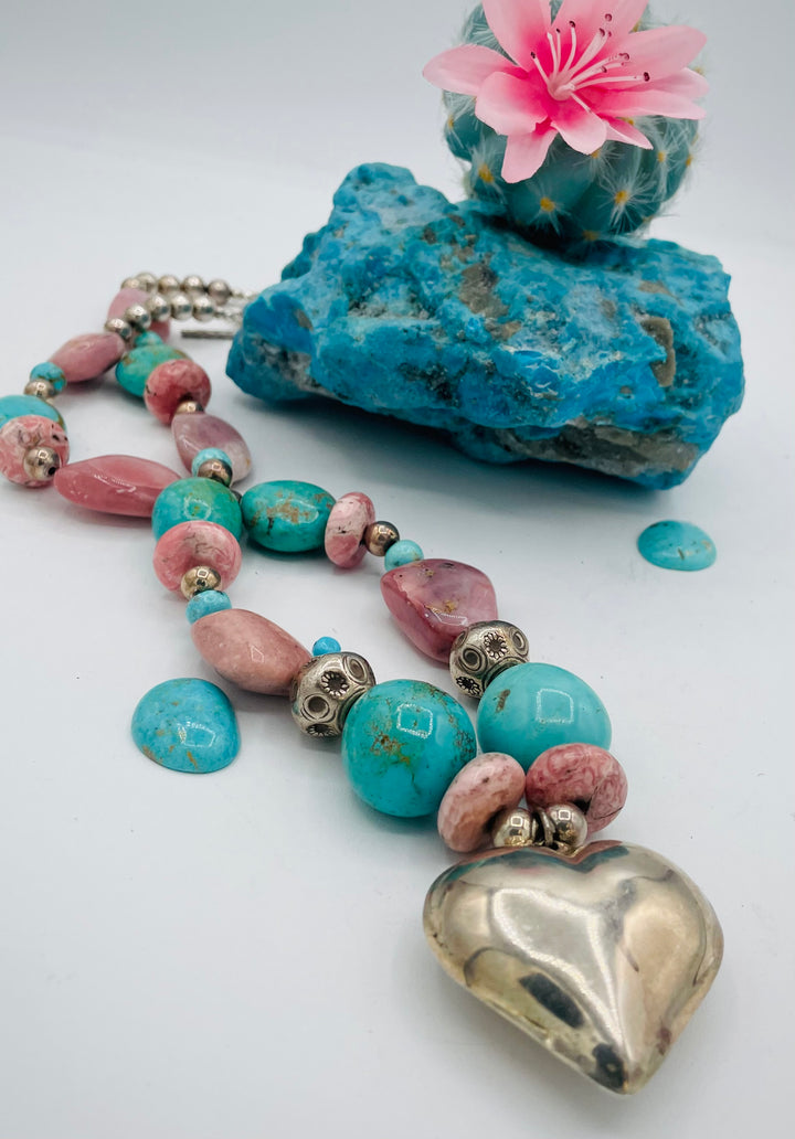 Chunky beaded necklace featuring Pink opal nuggets, rhodochrosite, sterling silver beads, Kingman turquoise nuggets, and sterling silver puffy heart pendent. Available only from Rockstar Cowgirl online or in store in Cody, Wyoming.
